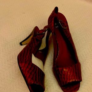 Woman’s 2 inch strap heel make a burgundy color never worn